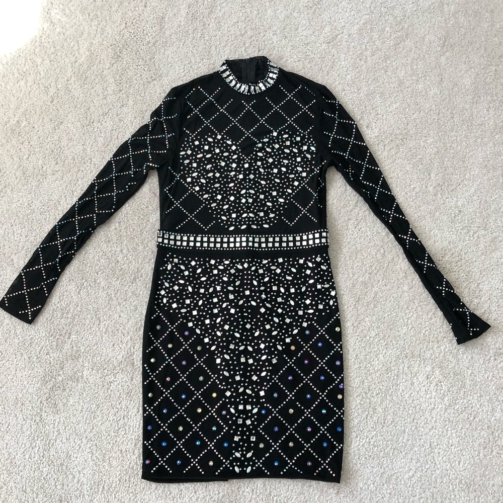 Size large.  Swarovski crystal dress . NEVER WORN !